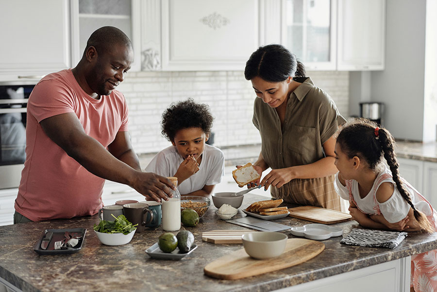 Family prepping meal in the kitchen